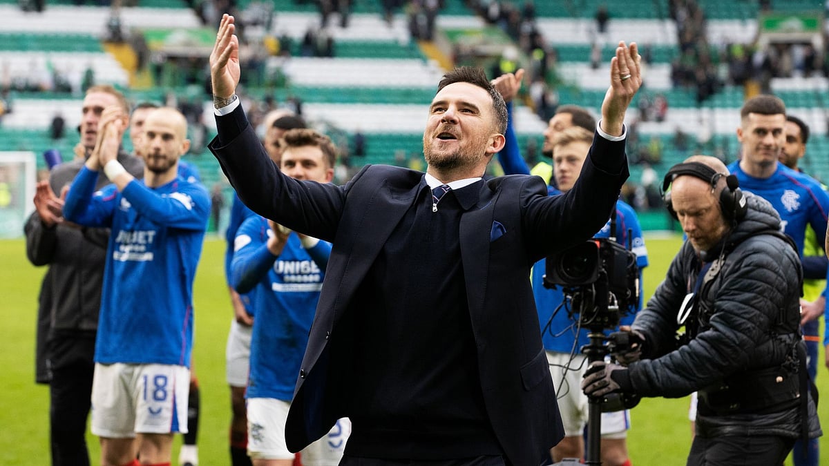 Ferguson celebrates with Rangers' supporters