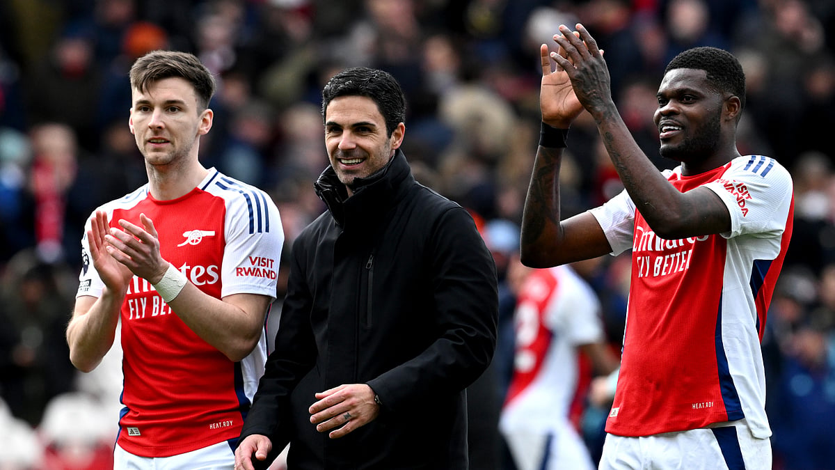 Mikel Arteta, Thomas Partey and Kieran Tierney celebrate Arsenal's win on Sunday