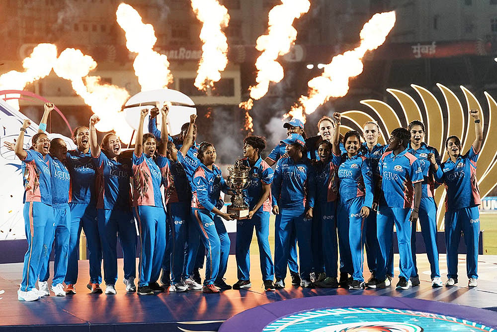 WPL Final 2025 MI vs DC: Mumbai Indians' players celebrate with the trophy - | Photo: PTI/Kunal Patil