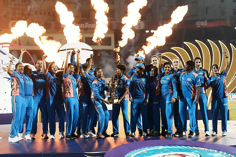 WPL Final 2025 MI vs DC: Mumbai Indians' players celebrate with the trophy - | Photo: PTI/Kunal Patil