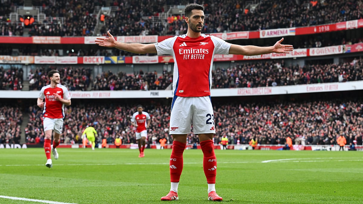 Mikel Merino celebrates his first-half opener for Arsenal - null