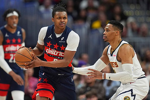 NBA 2024-25: Wizards guard Bub Carrington, left, looks to pass the ball