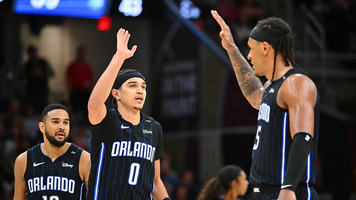 Anthony Black (#0) and Paolo Banchero (right) of the Orlando Magic celebrate vs. the Cleveland Cavaliers on March 16, 2025.
