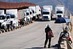 | Photo: AP : The Impact: A man sells peanuts to truck drivers at the US border in Tijuana, Mexico, as tariffs against Mexico go into effect