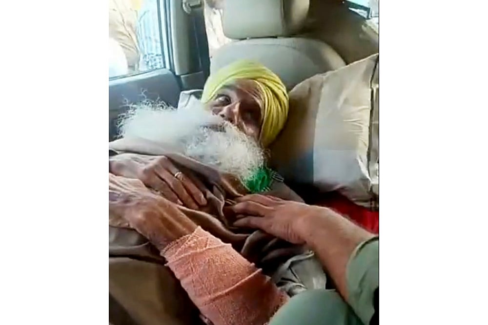 Farmer leader Jagjit Singh Dallewal being detained by the police, in Mohali.
