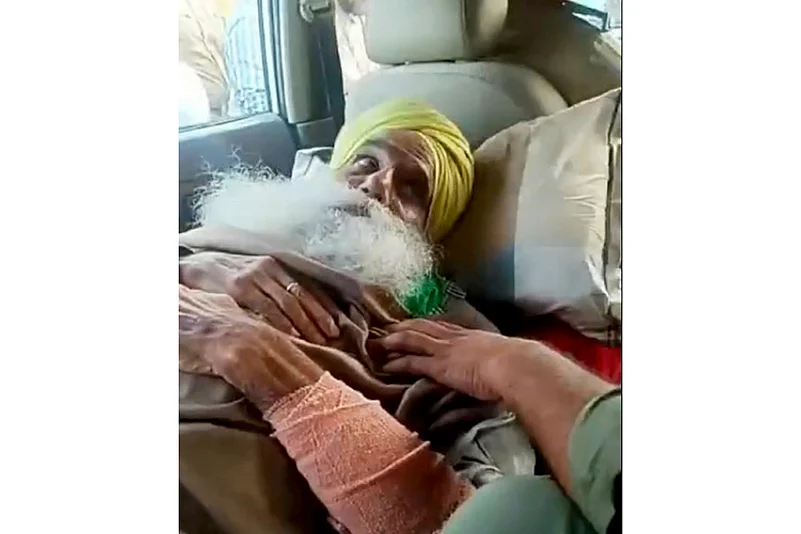 Farmer leader Jagjit Singh Dallewal being detained by the police, in Mohali.