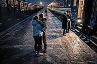 | Photo: Getty Images : Pain of Parting: A Ukrainian soldier and his girlfriend say goodbye at a 
train station in Kramatorsk, Ukraine, on December 10, 2023