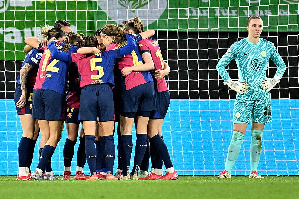 | Photo: Swen Pfoertner/dpa via AP : UWCL Quarter-Finals 1st Leg: VfL Wolfsburg vs FC Barcelona