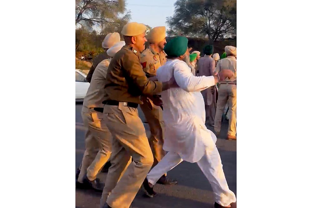 Farmers being detained by the police during a protest in Mohali.