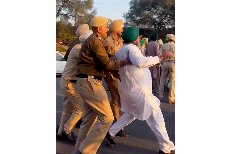 Farmers being detained by the police during a protest in Mohali.
