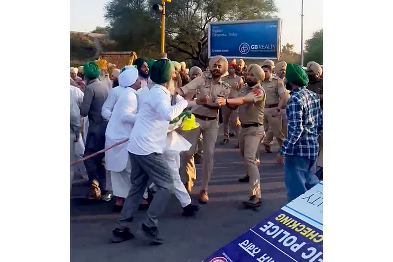 Farmers being detained by the police during a protest in Mohali.
