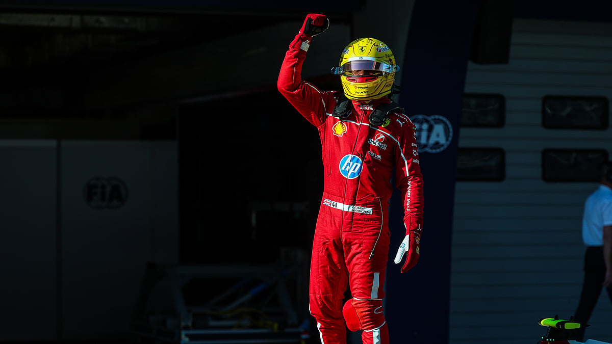 Lewis Hamilton celebrates after claiming sprint pole