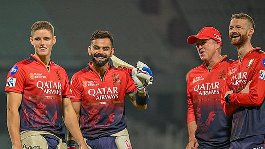 Virat Kohli and Jacob Bethell with RCB support staff. - X/RCBTweets