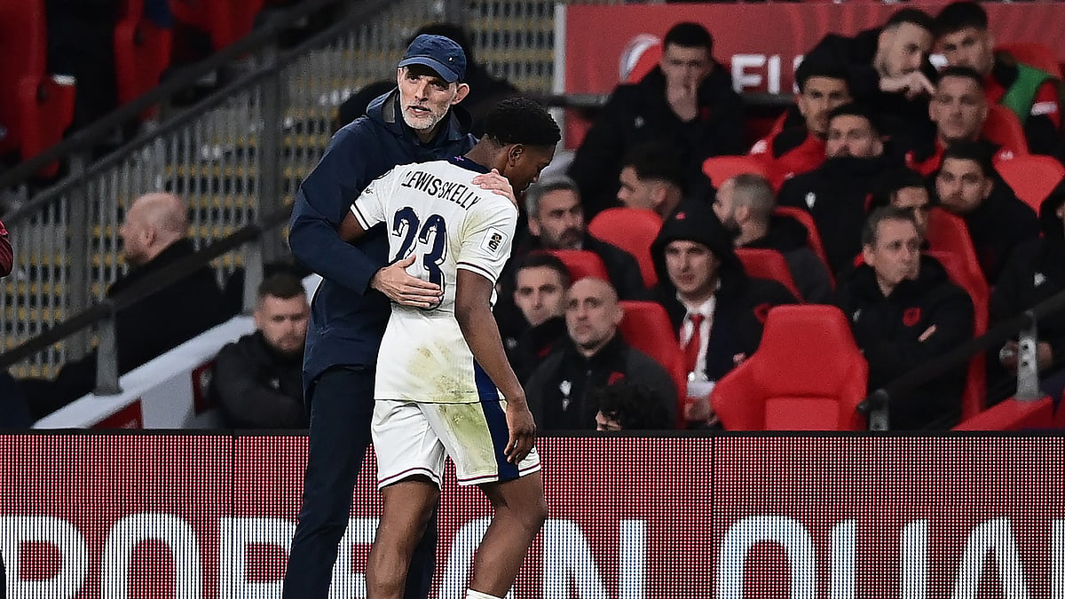England goalscorer Myles Lewis-Skelly with boss Thomas Tuchel. - null