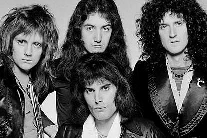 Freddie Mercury with Queen band