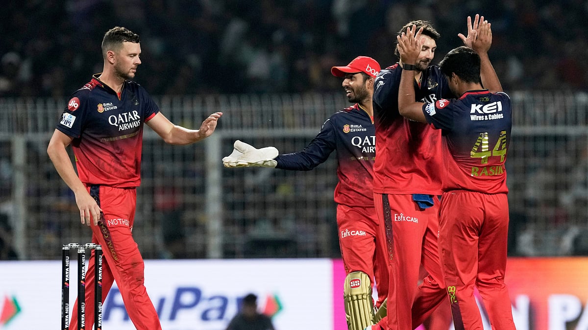 Royal Challengers Bengaluru's Rasikh Dar, right, celebrates with teammates after the dismissal of Kolkata Knight Riders' Sunil Narine during the Indian Premier League cricket match between Kolkata Knight Riders and Royal Challengers Bengaluru at Eden Gardens in Kolkata. - AP Photo/Bikas Das