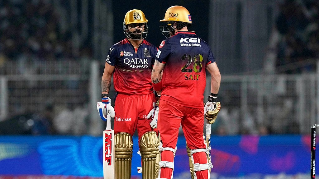 AP/Bikas Das : Phil Salt, left, and batting partner Virat Kohli have a chat during the Indian Premier League cricket match on Saturday.