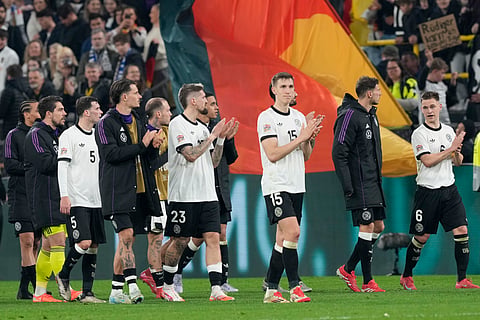 Germany's team players celebrate after the Nations League quarterfinal second leg soccer match between Germany and Italy at the Signal-Iduna Park in Dortmund, Germany, Sunday, March 23, 2025. 