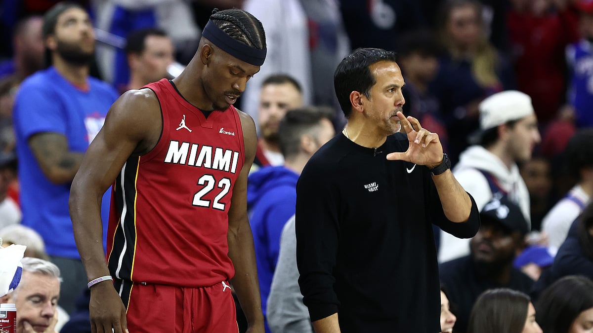 Erik Spoelstra and Jimmy Butler pictured last season