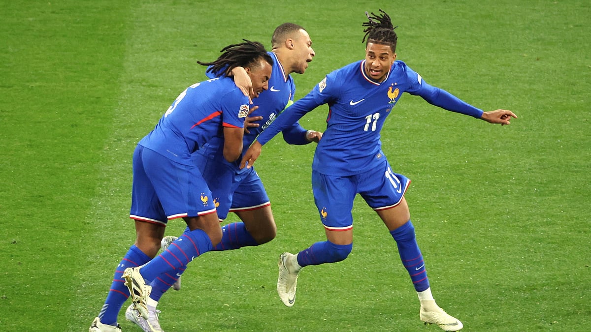 Michael Olise celebrates his goal with Kylian Mbappe and Jules Kounde