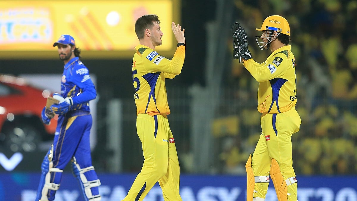 AP Photo/R. Parthibhan : Chennai Super Kings' Noor Ahmad, centre, celebrates with teammate Mahendra Singh Dhoni the dismissal of Mumbai Indians' Tilak Verma, left, during the Indian Premier League cricket match between Chennai Super Kings and Mumbai Indians in Chennai.
