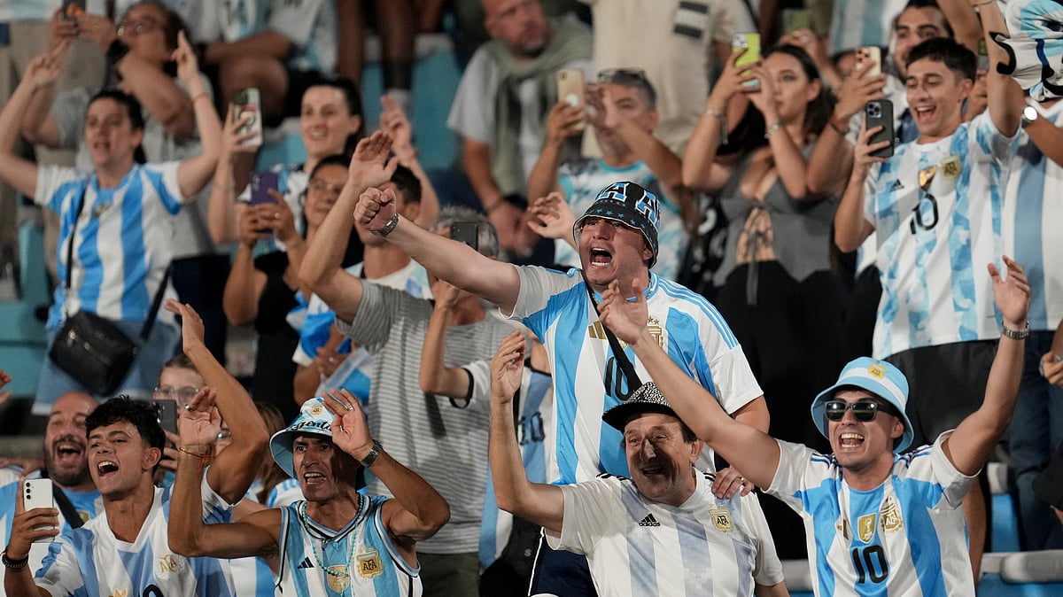 Fans of Argentina react before the start of a qualifying soccer match for the FIFA World Cup 2026 against Uruguay in Montevideo, Uruguay, Friday, March 21, 2025.  - (AP Photo/Matilde Campodonico)