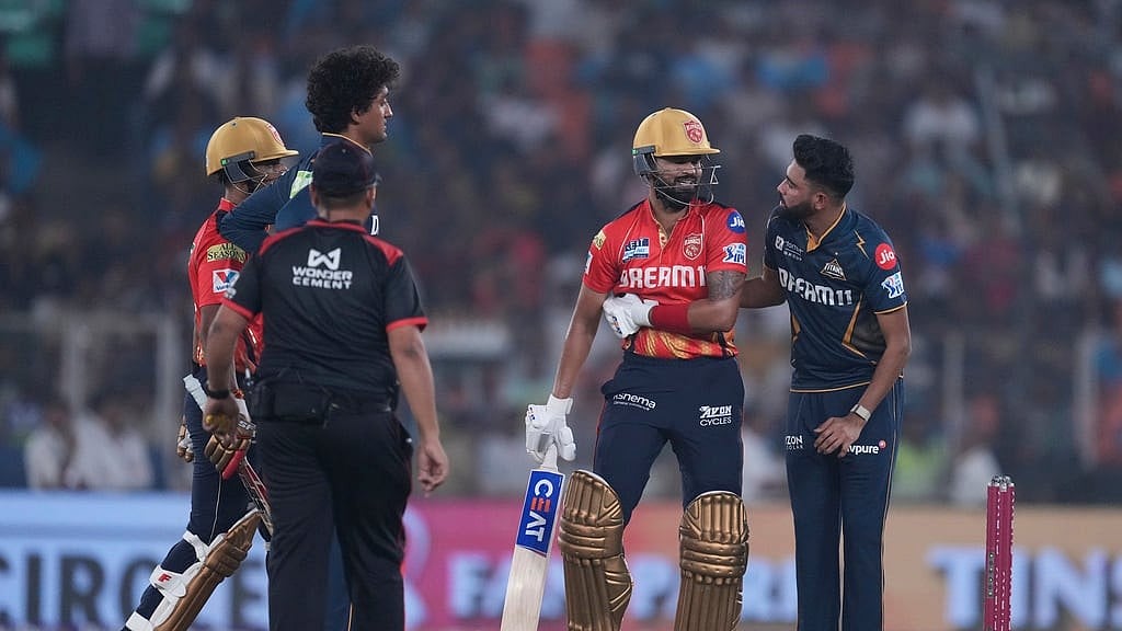 Mohammed Siraj talks to Punjab Kings captain Shreyas Iyer after a ball hit him during IPL