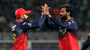 AP Photo/Bikas Das : Royal Challengers Bengaluru's Krunal Pandya, right, celebrates with teammate Virat Kohli after the dismissal of Kolkata Knight Riders' Rinku Singh during the Indian Premier League cricket match between Kolkata Knight Riders and Royal Challengers Bengaluru at Eden Gardens in Kolkata.