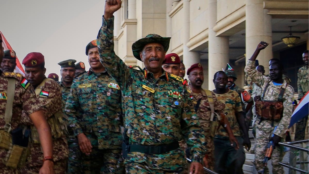 | Photo: AP : Sudan's military chief Gen. Abdel-Fattah Burhan (center), is greeted by troops as he arrives at the Republican Palace, recently recaptured from the Rapid Support Forces paramilitary group, in Khartoum, Sudan.