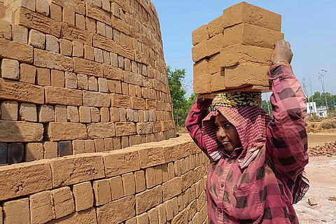 Woman at brick kiln
