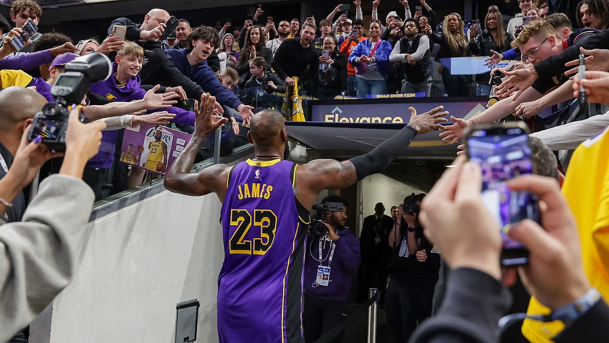 LeBron James #23 of the Los Angeles Lakers acknowledges fans following the game against the Indiana Pacers at Gainbridge Fieldhouse on March 26, 2025 in Indianapolis, Indiana. - null