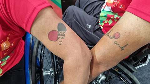 Sonalben and Ramesh sport a tattoo of a table tennis paddle on her bicep.