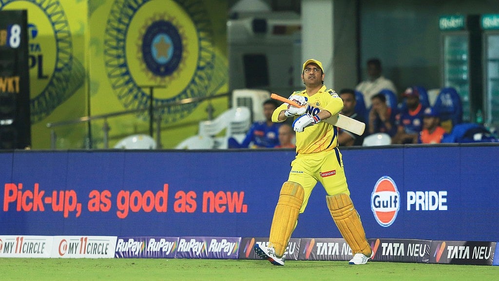MS Dhoni walks out to bat. - AP/R. Parthibhan