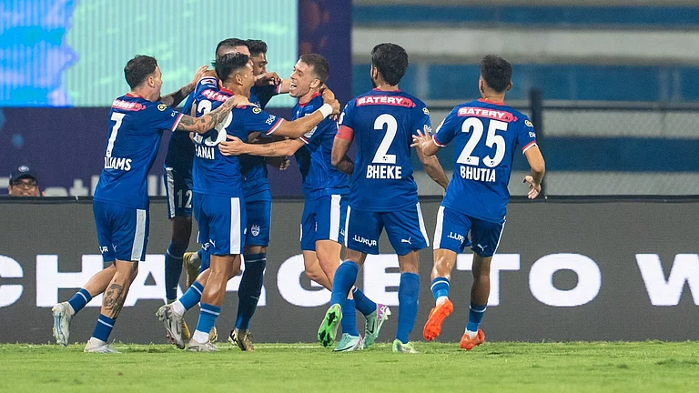 Bengaluru FC players celebrate a goal against Mumbai City FC in the Indian Super League. - FSDL/ISL