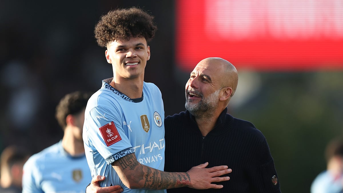 Nico O'Reilly and Pep Guardiola - null