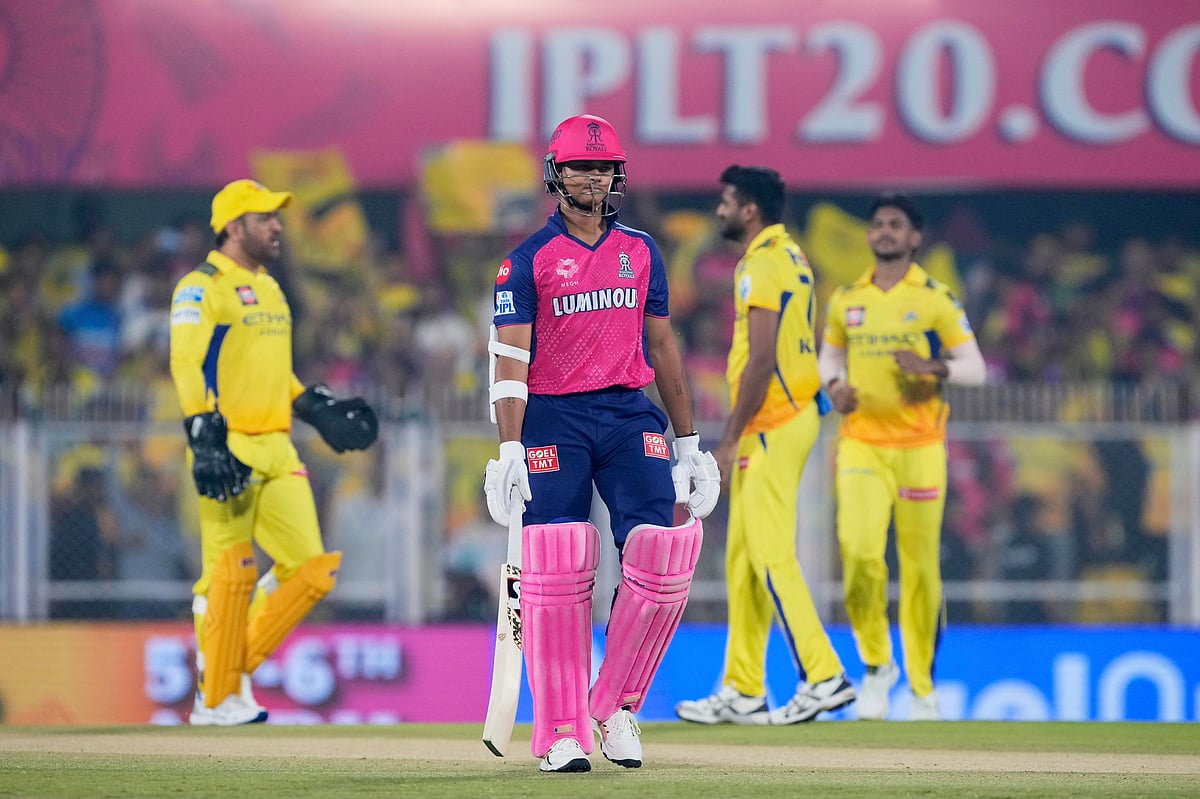 Rajasthan Royals' Yashasvi Jaiswal walks off the field after losing his wicket as Chennai Super Kings' players celebrate during the Indian Premier League cricket match between Chennai Super Kings and Rajasthan Royals at Barsapara Cricket Stadium in Guwahati, India, Sunday, March 30, 2025. 

