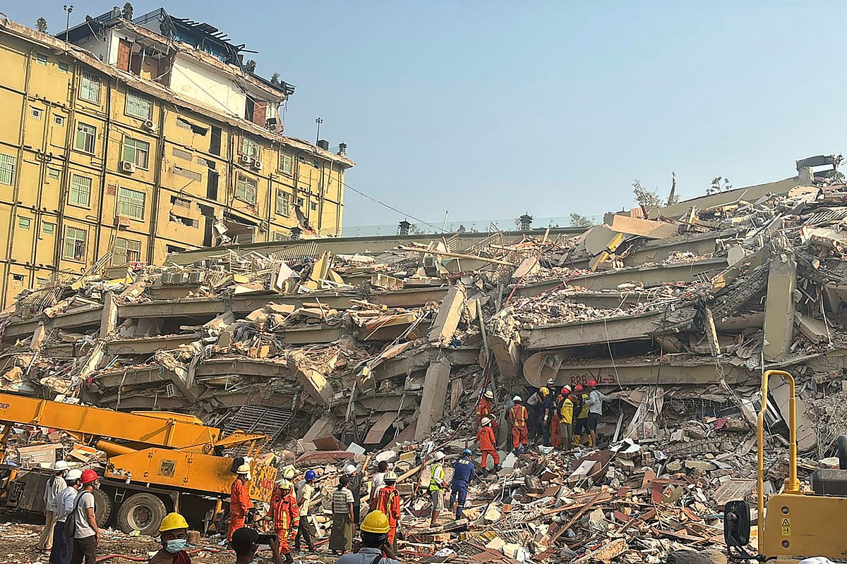 Rescuers work at the Sky Villa Condo that collapsed In Friday's earthquake in Mandalay, Myanmar, Sunday, March 30, 2025.  - AP Photo/Thein Zaw