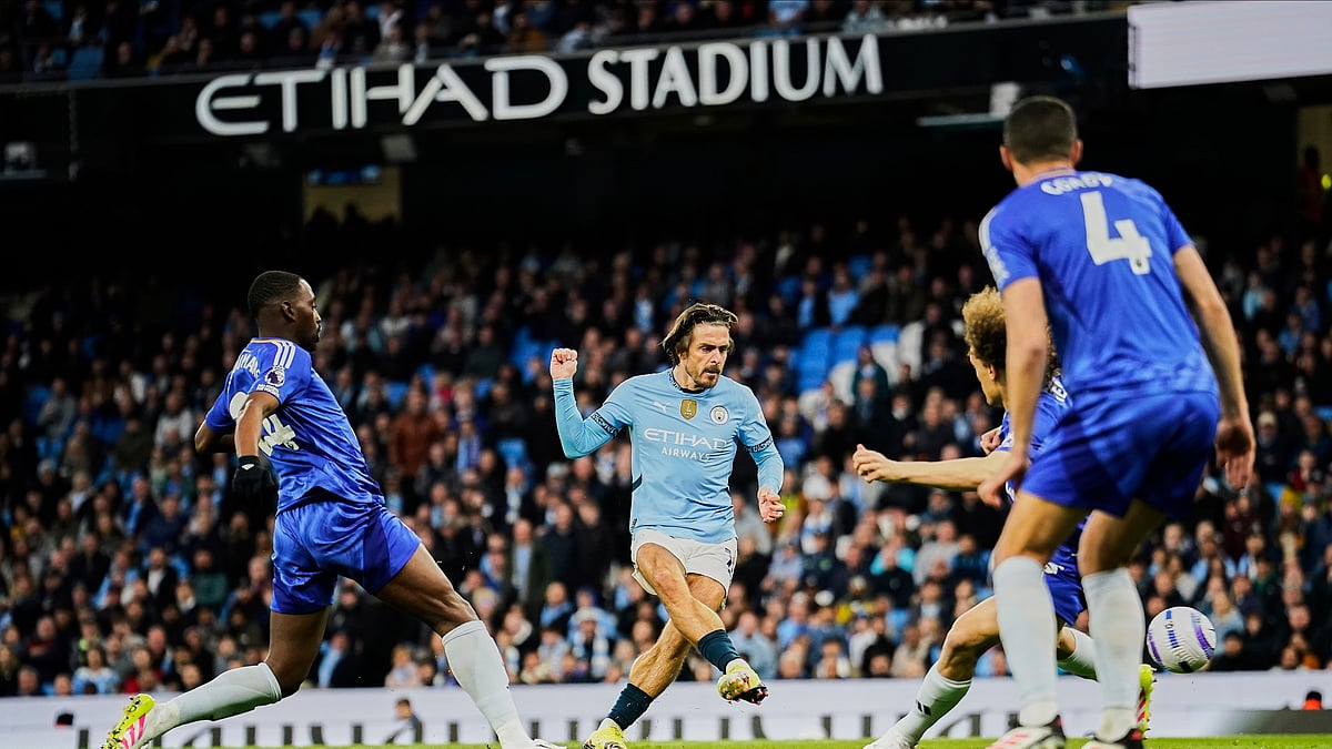 Manchester Citys Jack Grealish, center, scores the opening goal. AP