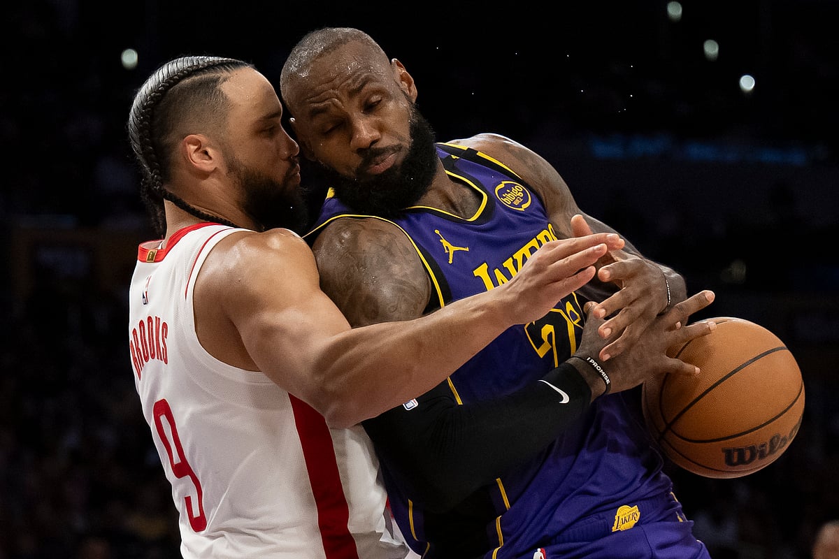 (AP Photo/Kyusung Gong) : Los Angeles Lakers forward LeBron James (23) loses the ball as Houston Rockets forward Dillon Brooks (9) defends during the second half of an NBA basketball game in Los Angeles, Monday, March 31, 2025.
