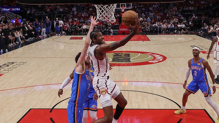 Jalen Green of the Houston Rockets goes up for a lay up in front of Chet Holmgren - null