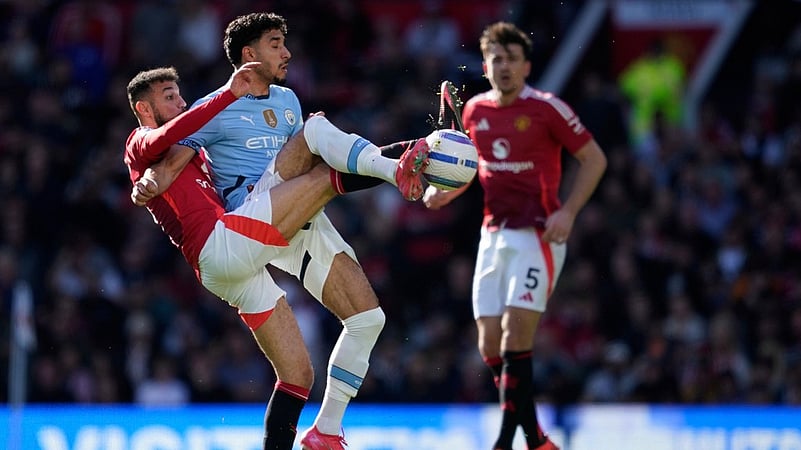 Manchester Uniteds Noussair Mazraoui, left, and Manchester Citys Omar Marmoush