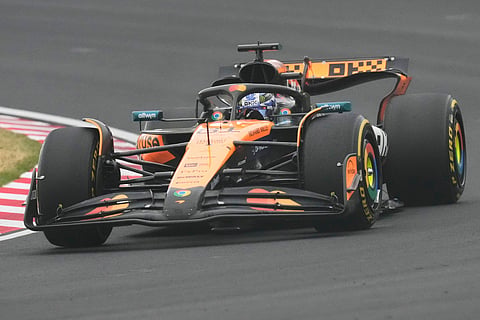 McLaren driver Oscar Piastri of Australia steers his car during the Japanese Formula One Grand Prix at the Suzuka Circuit in Suzuka, central Japan, Sunday, April 6, 2025. 


