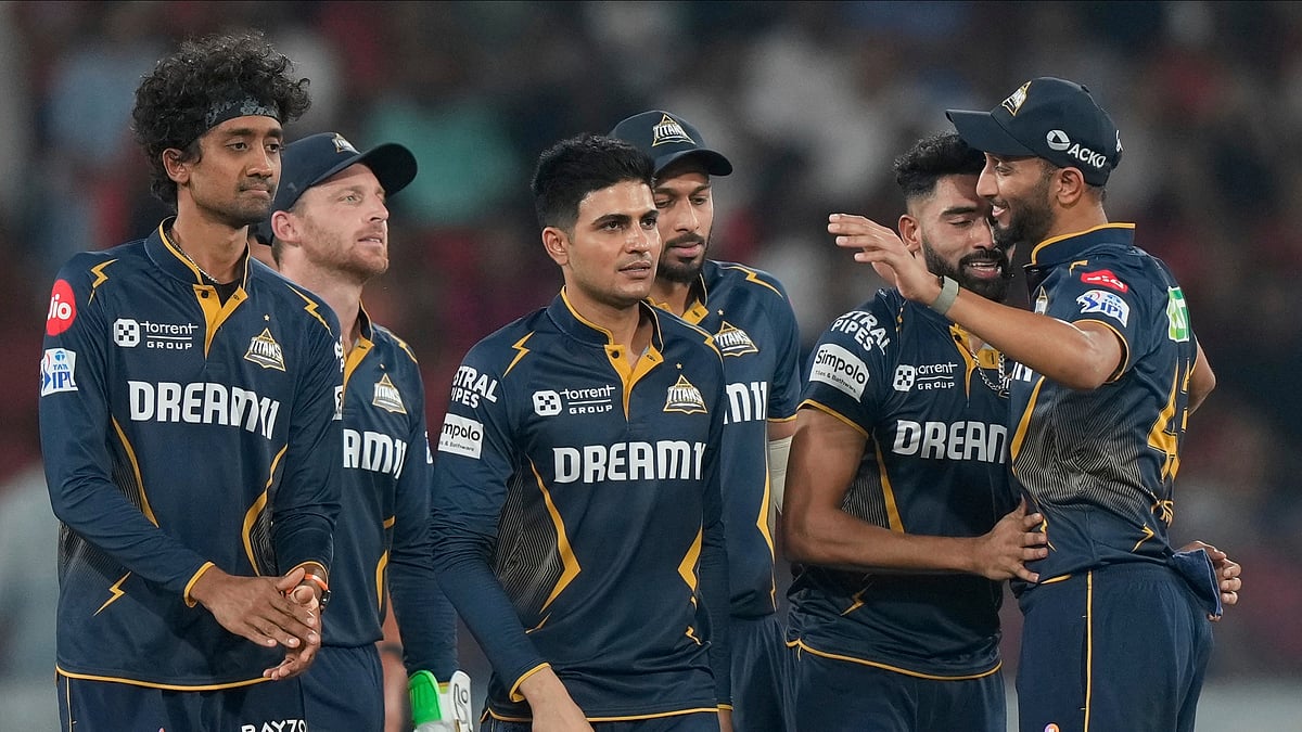 Gujarat Titans' Mohammed Siraj celebrates the wicket of Sunrisers Hyderabad's Abhishek Sharma during the Indian Premier League cricket match between Sunrisers Hyderabad and Gujarat Titans at Rajiv Gandhi International Cricket Stadium in Hyderabad. - AP Photo/Mahesh Kumar A.