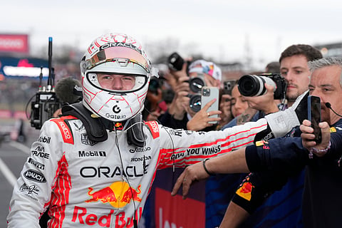 Red Bull driver Max Verstappen of the Netherlands celebrates after winning the Japanese Formula One Grand Prix race at the Suzuka Circuit in Suzuka, central Japan, Sunday, April 6, 2025.

