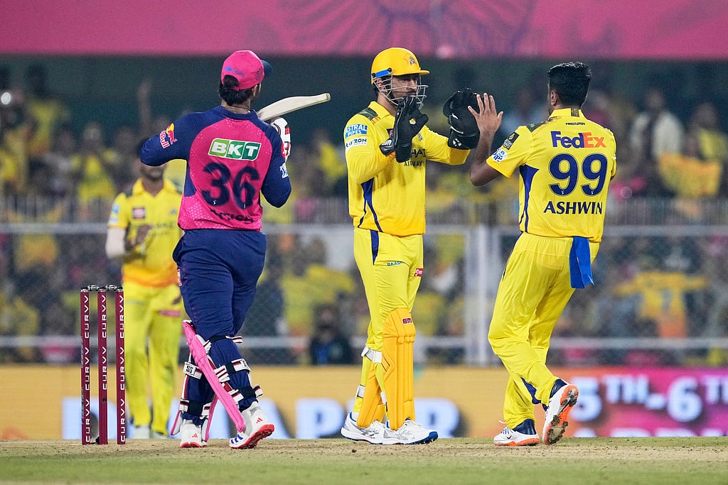 AP/Anupam Nath : R Ashwin celebrates with MS Dhoni