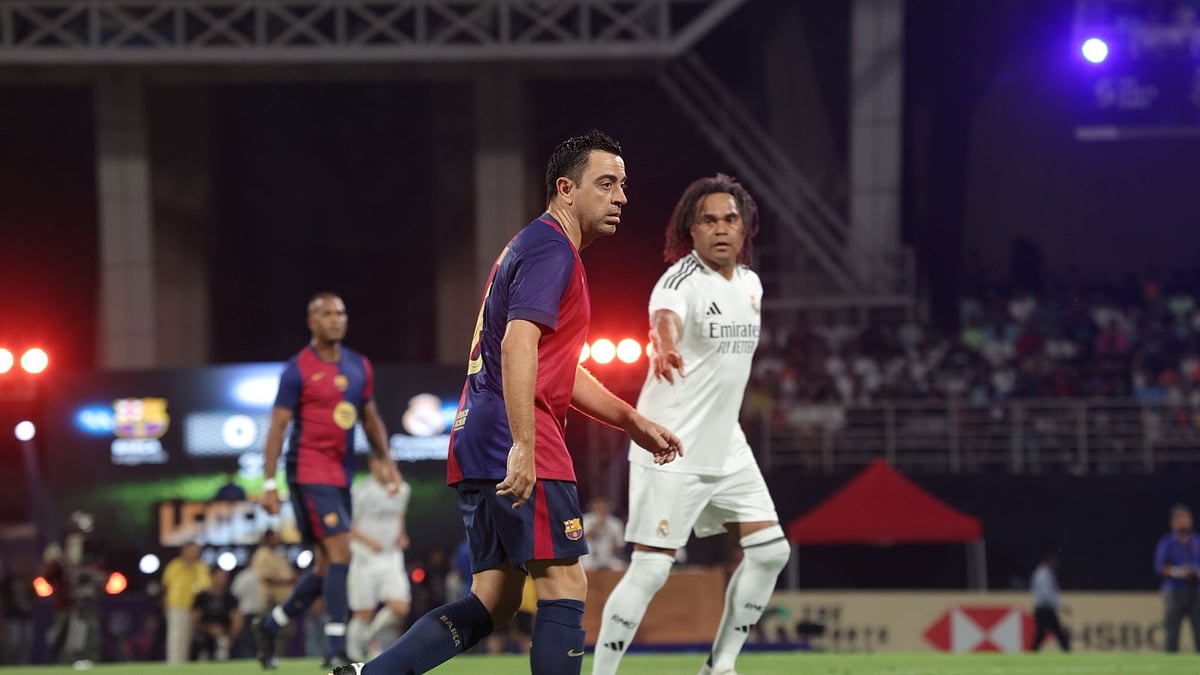 Special Arrangement : Xavi Hernandez (centre) in action during the 'Legends Face-Off' El Clasico clash in Navi Mumbai.