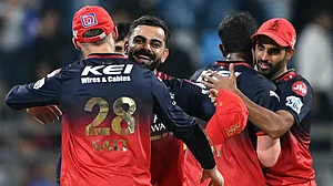 Royal Challengers Bengaluru celebrate their win over Mumbai Indians.