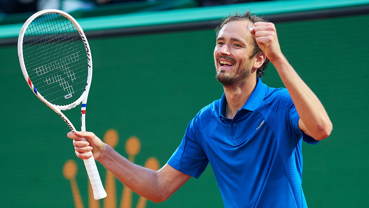 File : File photo of Daniil Medvedev celebrates after converting match point.