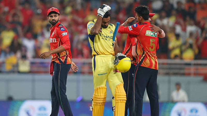 Chennai Super Kings Vijay Shankar, center, reacts as players of PBKS celebrate. AP