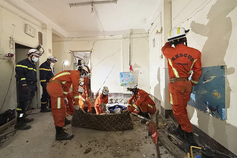 Rescue workers working through rubbles in earthquake-hit Myanmar